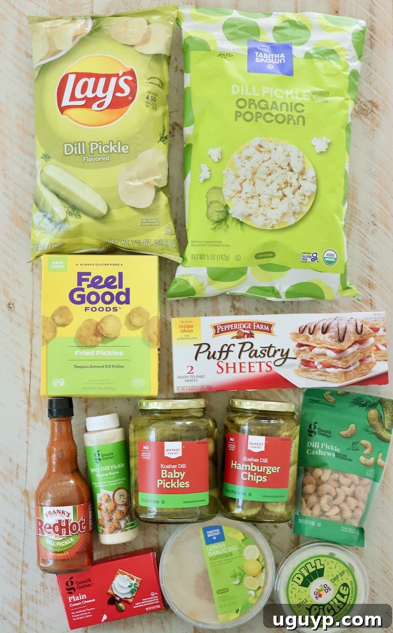 An inviting white wooden board artfully arranged with an assortment of pickle-flavored snacks, including crisp chips, fluffy popcorn, and various dips.