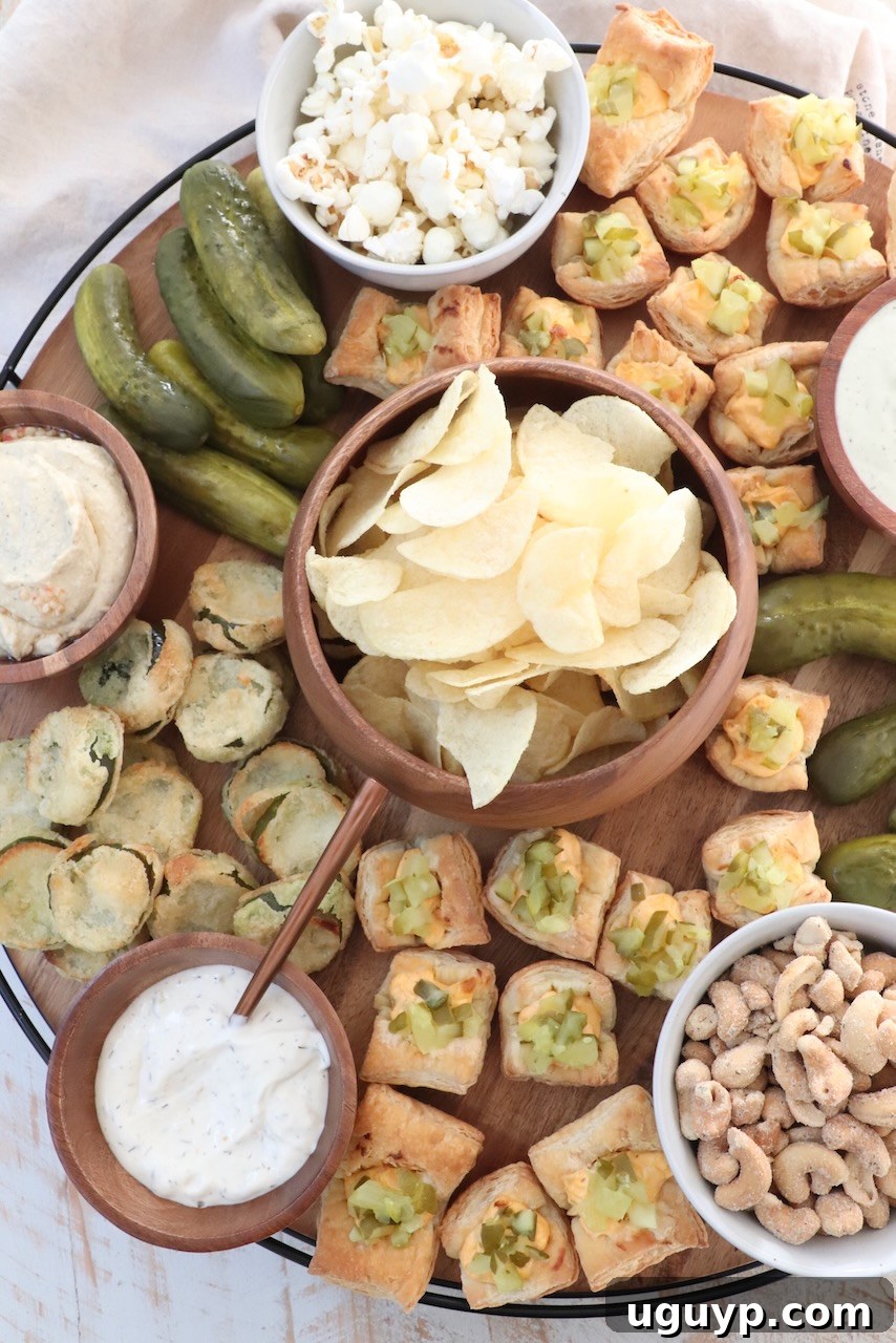 An overhead view of a diverse selection of pickles and savory snacks, elegantly arranged on a large wooden board, ready for enjoyment.