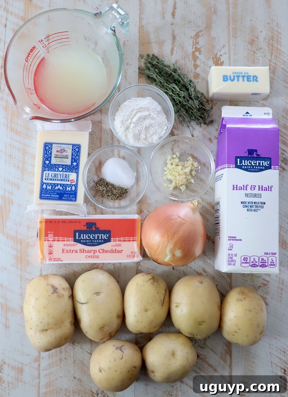A collection of fresh ingredients for au gratin potatoes laid out on a rustic white wooden board, including whole potatoes, cheeses, herbs, and dairy.