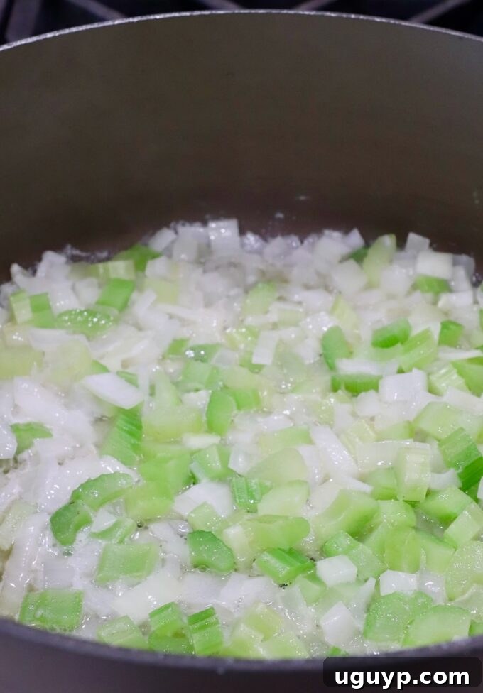 diced onions and celery in a large pot