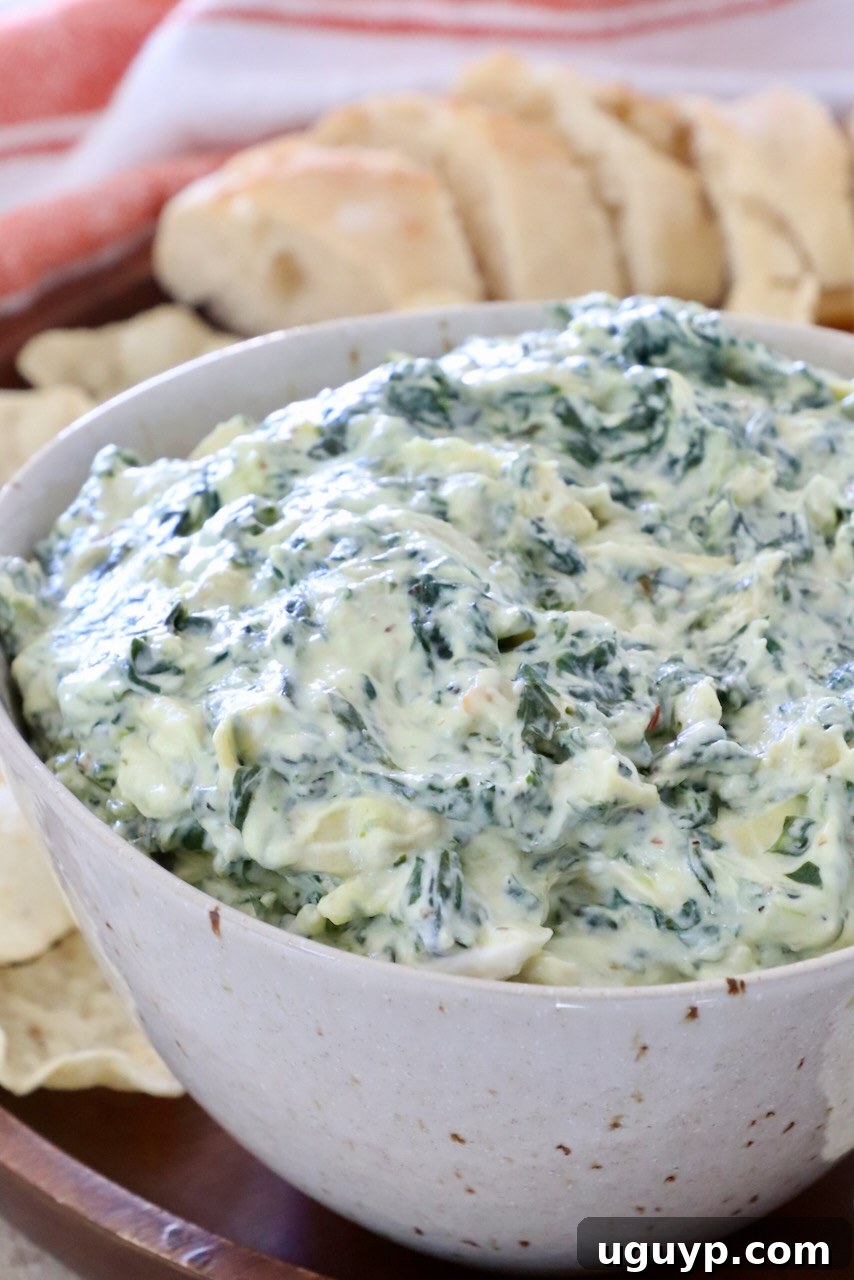 a bowl of creamy spinach artichoke dip ready for serving