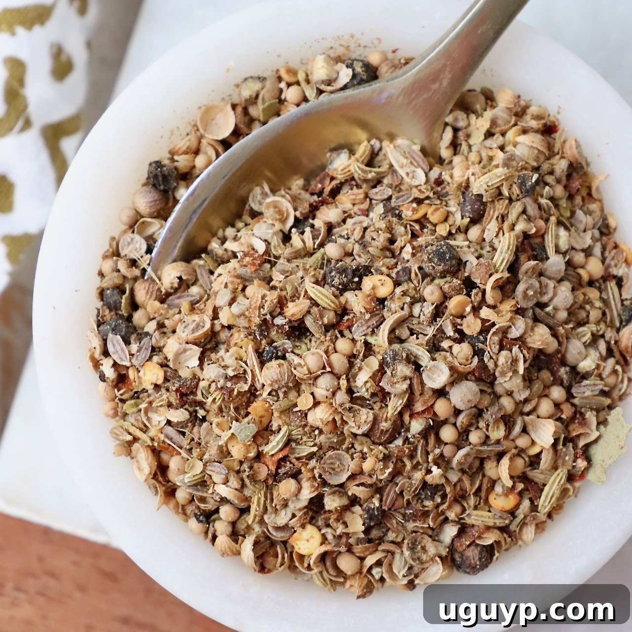 Corned beef seasoning in a bowl with a small spoon