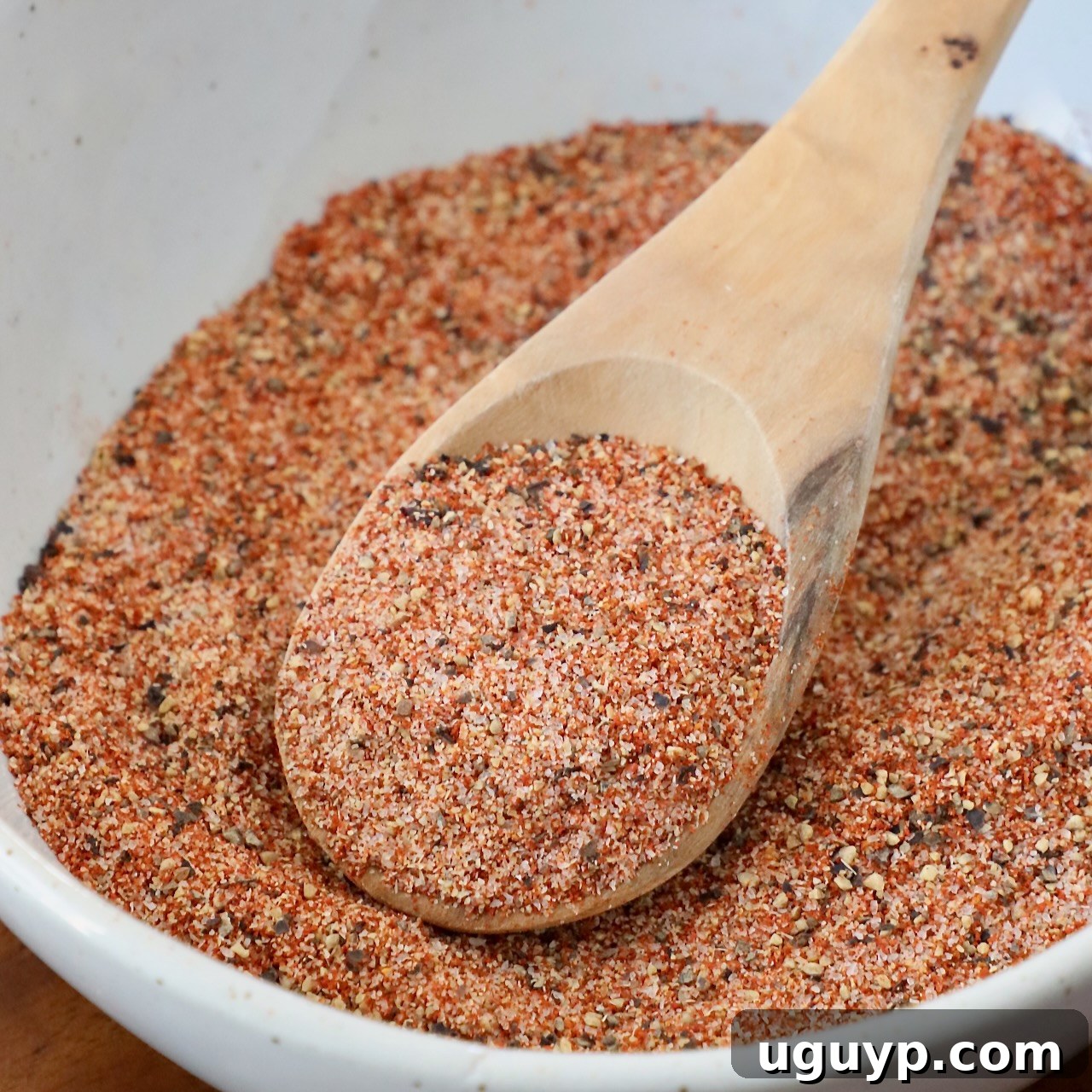 Hamburger seasoning in a bowl with a spoon