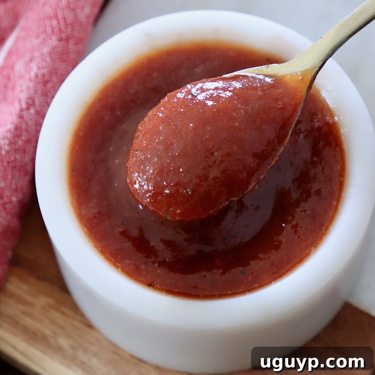 Jack Daniel's BBQ sauce in a bowl with a small spoon