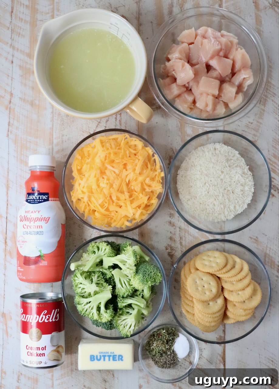 ingredients for chicken broccoli rice casserole laid out on a white wooden board, ready for preparation