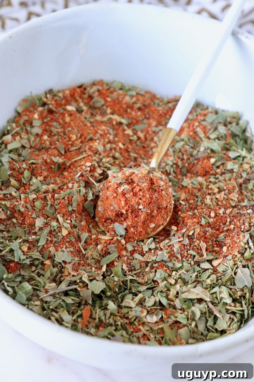 pizza seasoning in a bowl with a small spoon