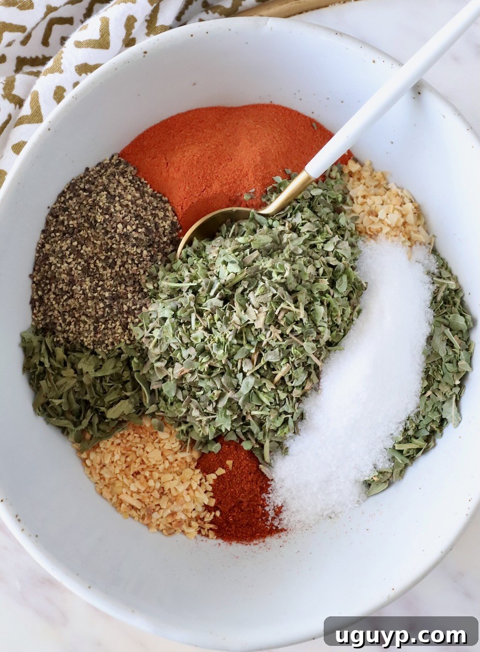 spices separated in a bowl with a spoon