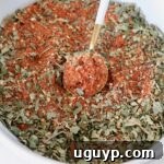 pizza seasoning in a bowl with a spoon