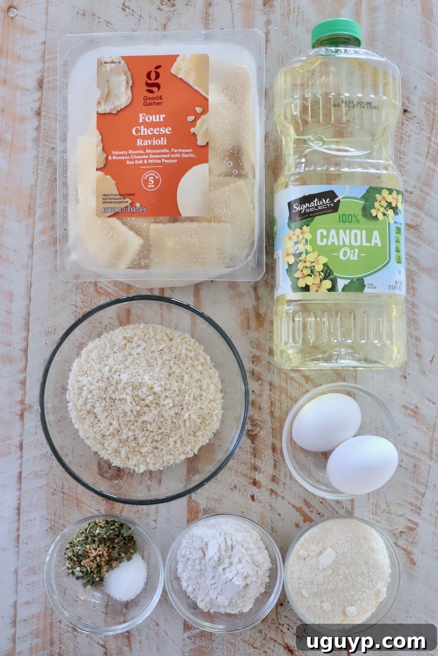 A perfectly arranged selection of ingredients for toasted ravioli on a rustic white wooden board, showcasing fresh ravioli, breadcrumbs, cheese, and seasonings.