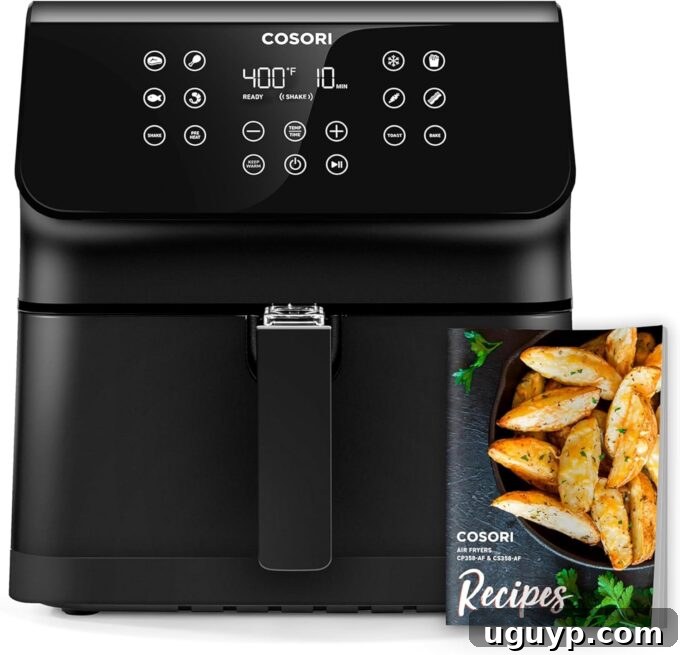 cosori air fryer with recipe book in front of the air fryer