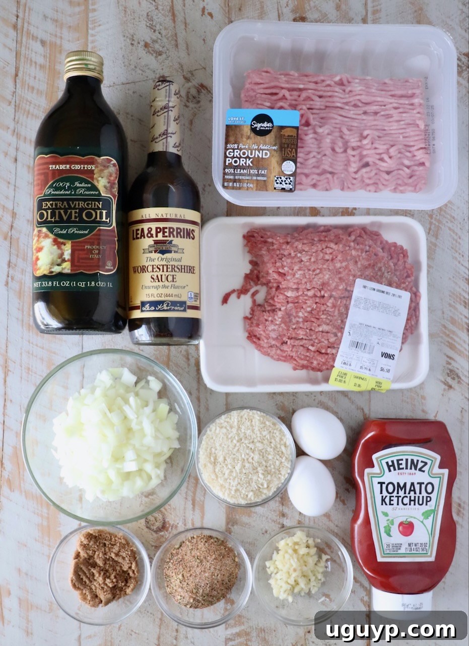 ingredients for air fryer meatloaf on a white wood board