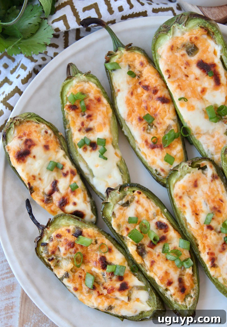 Cooked jalapeno poppers on a plate, ready to be eaten
