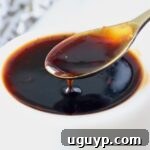 A small white bowl filled with glossy, rich Korean BBQ sauce, ready to be enjoyed.