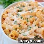 Cheesy baked pasta in casserole dish, ready to be served