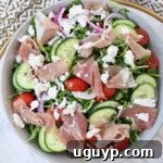 Prosciutto Salad with Cucumber and Arugula in a serving bowl, ready to be enjoyed