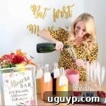 Woman pouring champagne into glass at a mimosa bar