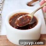 general tso sauce in a small bowl with a spoon