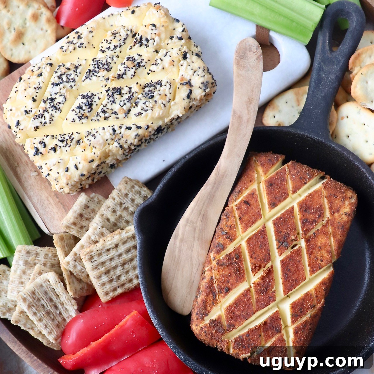 Smoked cream cheese in a skillet with a wooden serving spoon, ready to be enjoyed.