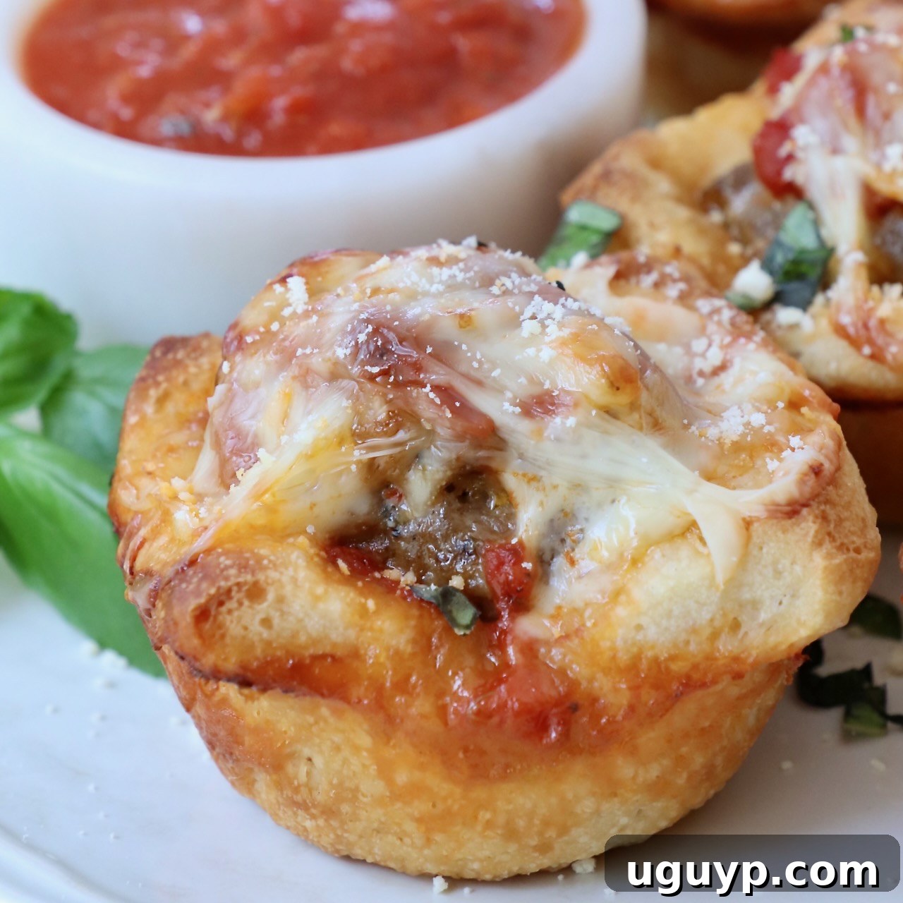 Meatball sub bite on a plate, ready to be served.