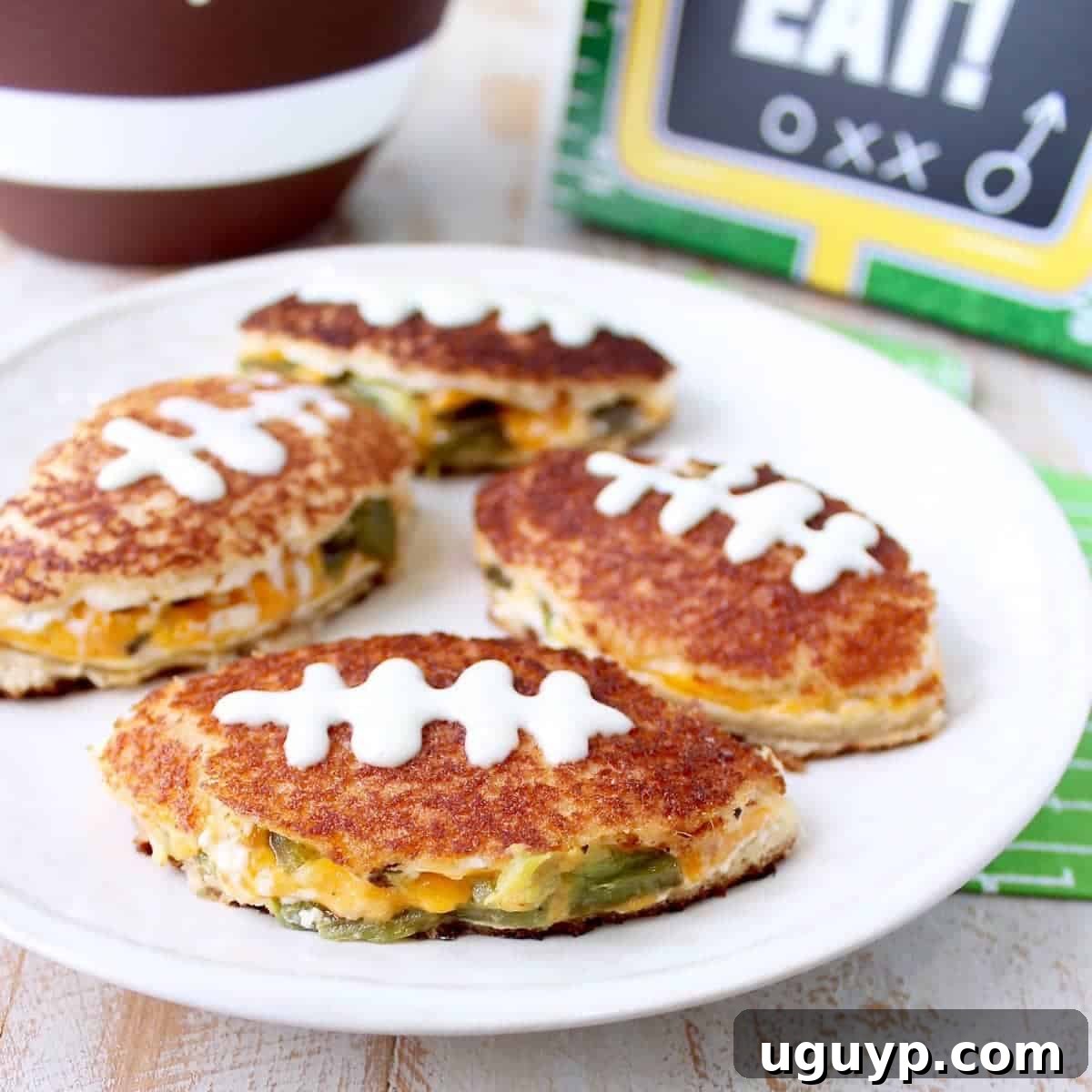 Jalapeno Popper Grilled Cheese Sandwiches cut into football shapes.