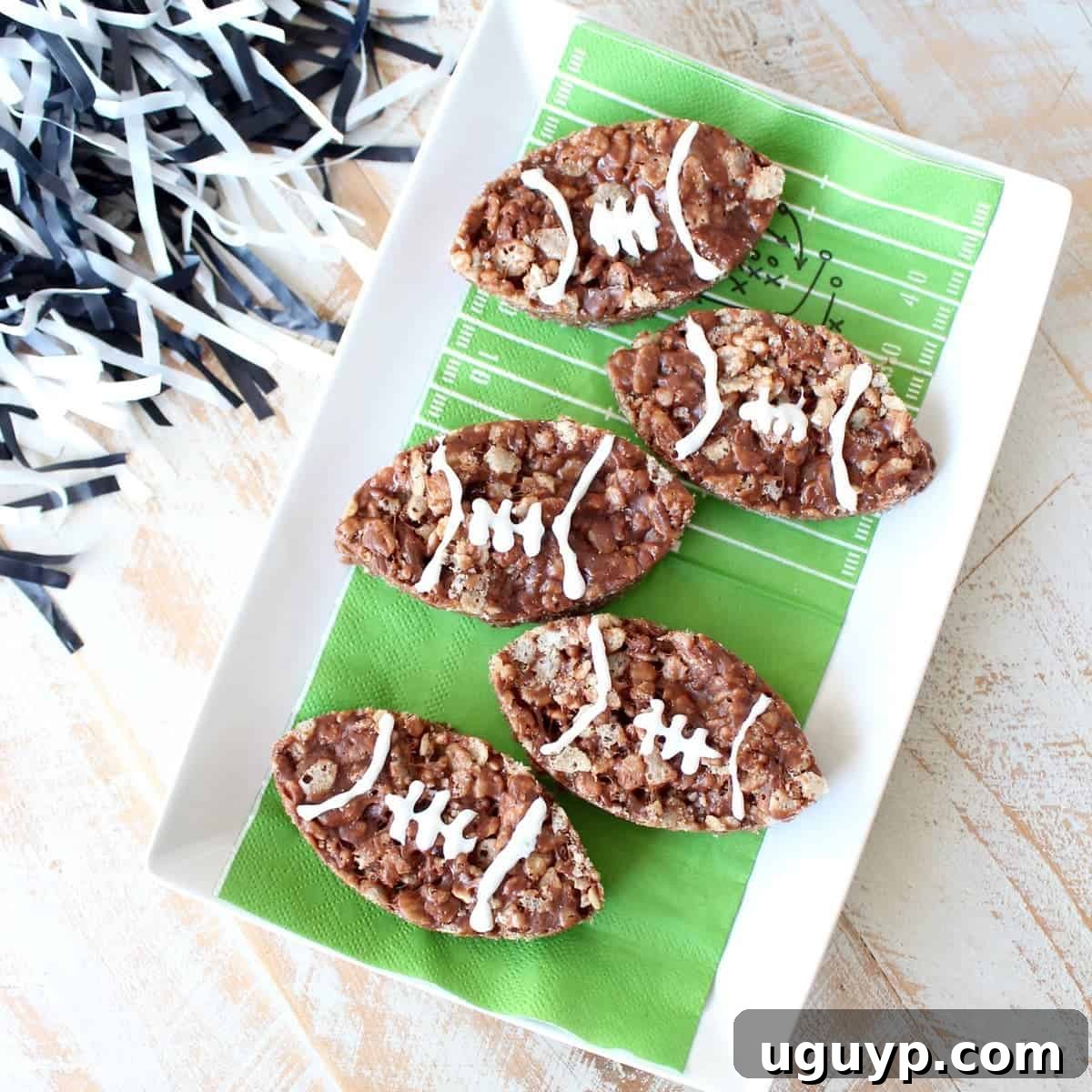 Nutella Rice Krispie Treats shaped like footballs, perfect for game day dessert.