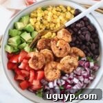 Mexican Shrimp Salad in a bowl with a fork, ready to eat.
