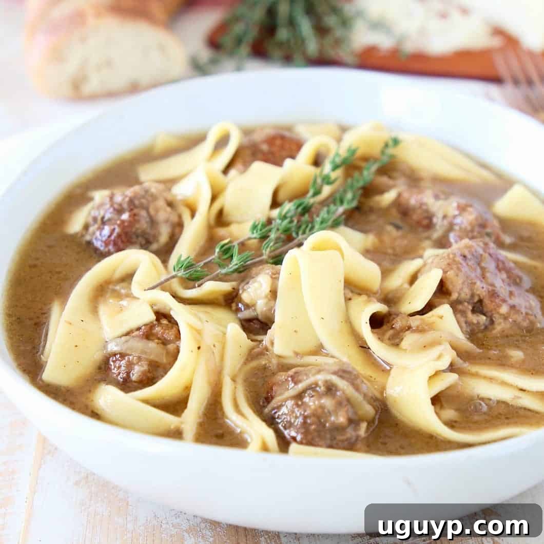Hearty Slow Cooker French Onion Meatball Soup, featuring delicious meatballs and rich caramelized onions.