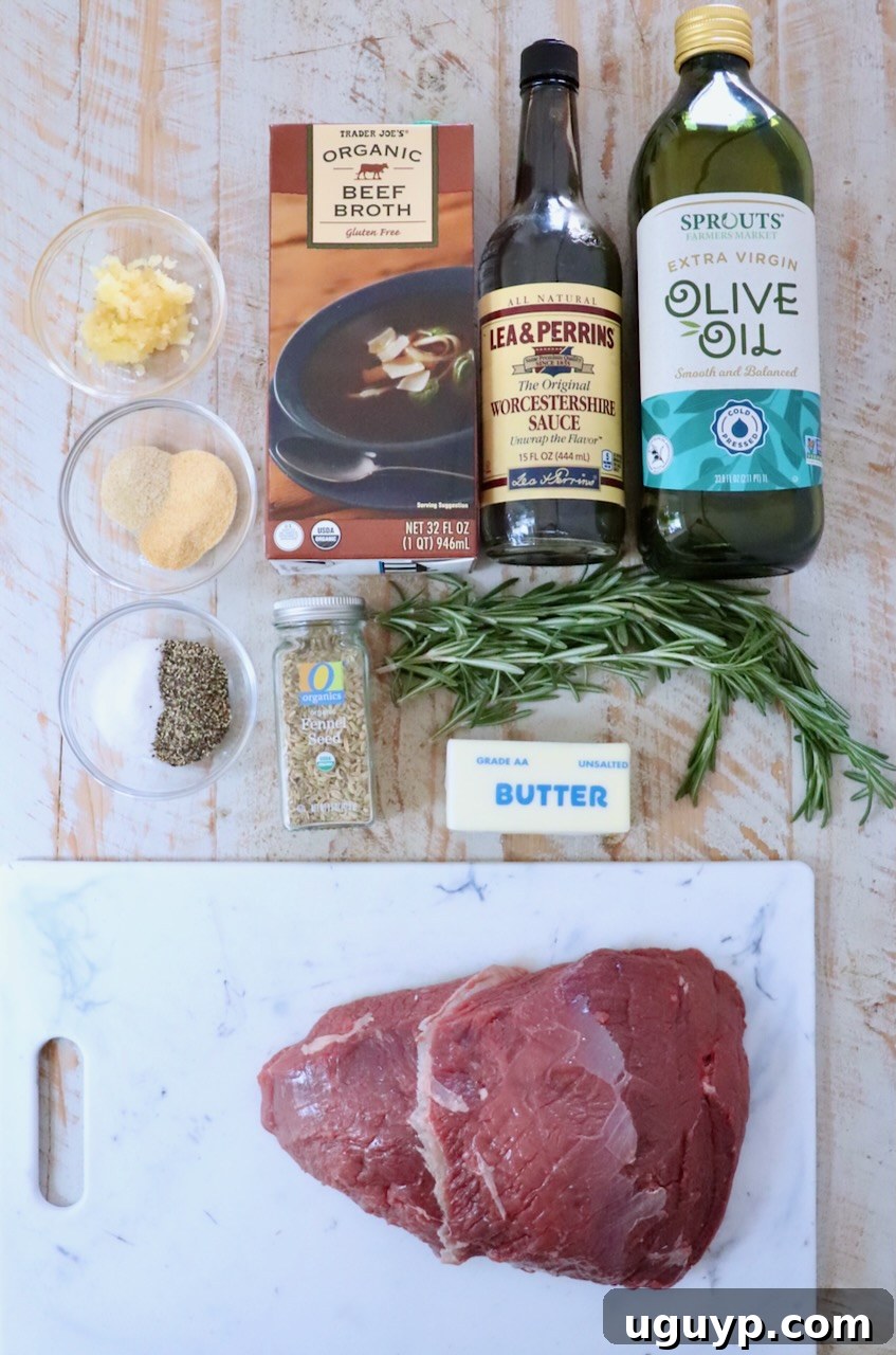 Ingredients for cooking a roast, including raw meat on a cutting board, a rosemary sprig, beef broth, olive oil, Worcestershire sauce, spices, and butter.