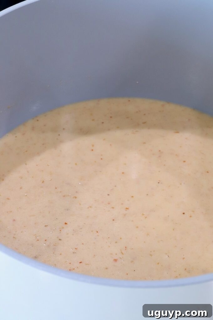creamy red curry sauce in a pot