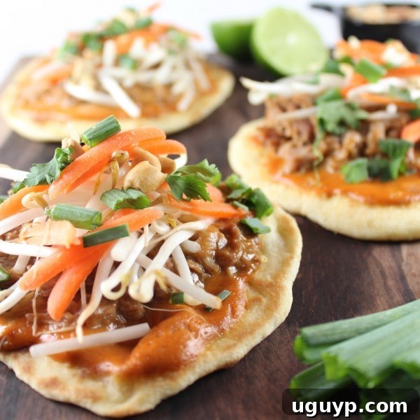 Fresh ingredients for Thai Pizza laid out, including bean sprouts, carrots, cilantro, and green onions.