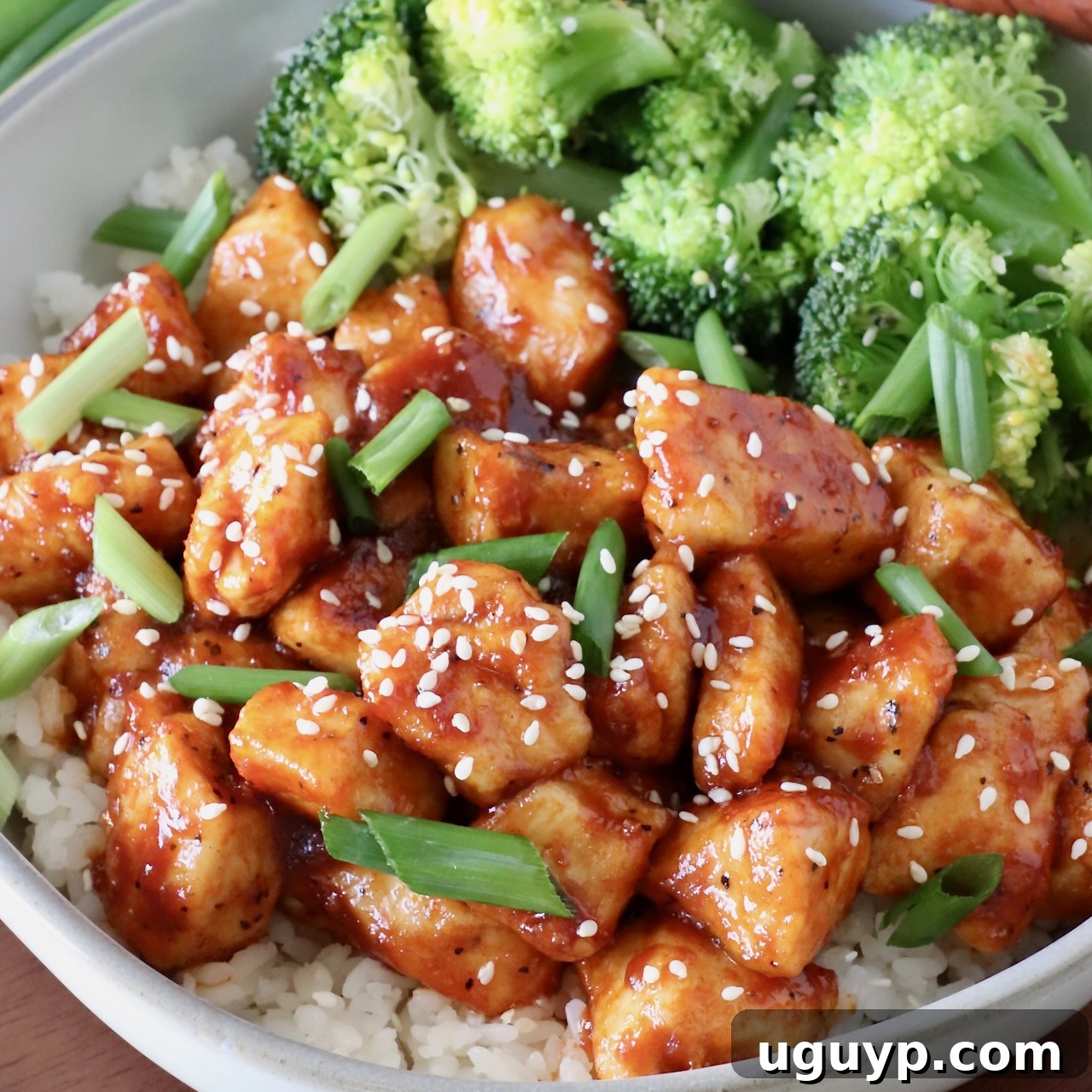 gochujang chicken in a bowl with rice and broccoli