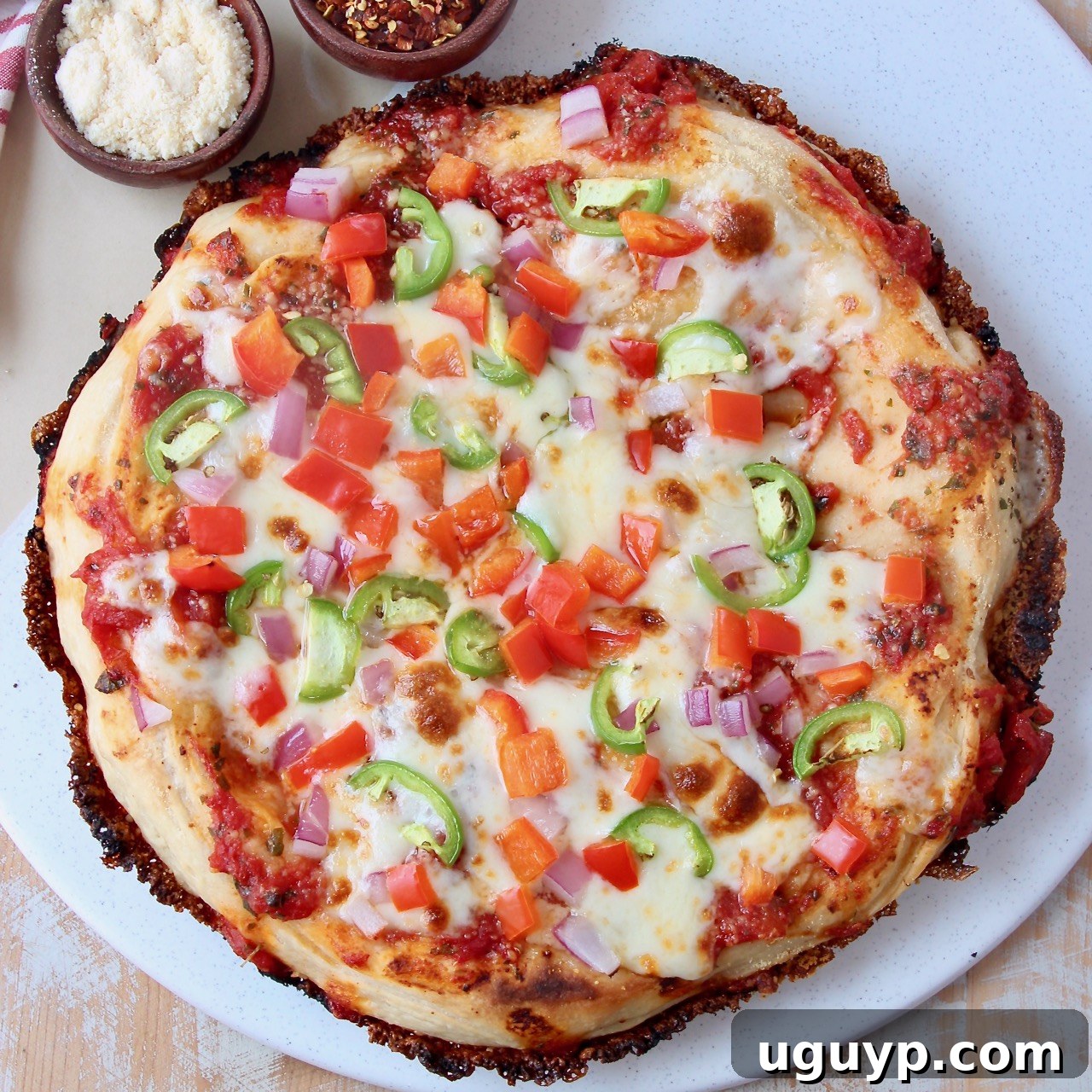 overhead image of cooked pizza on marble serving tray