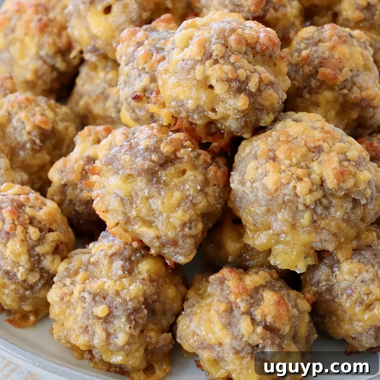 sausage balls stacked up on plate