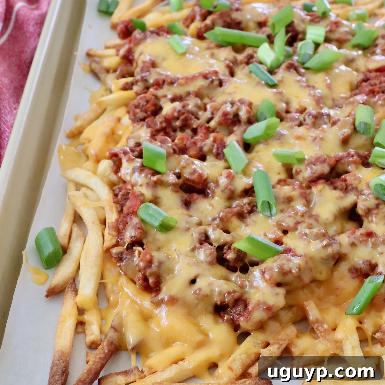chili cheese fries on baking sheet
