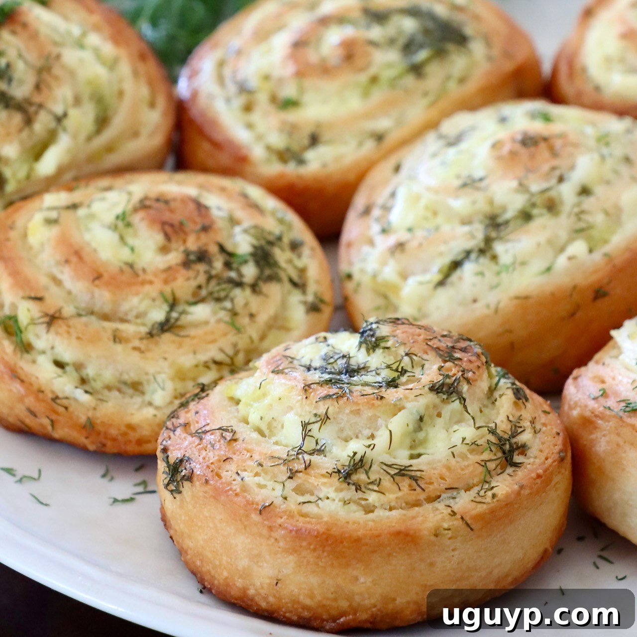 baked pickle rolls on a plate
