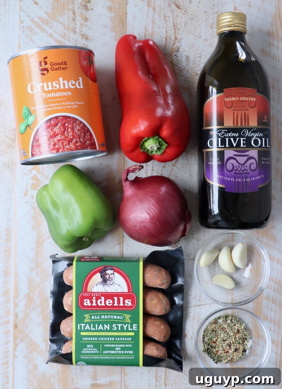 ingredients for Italian sausage and peppers laid out on a white board