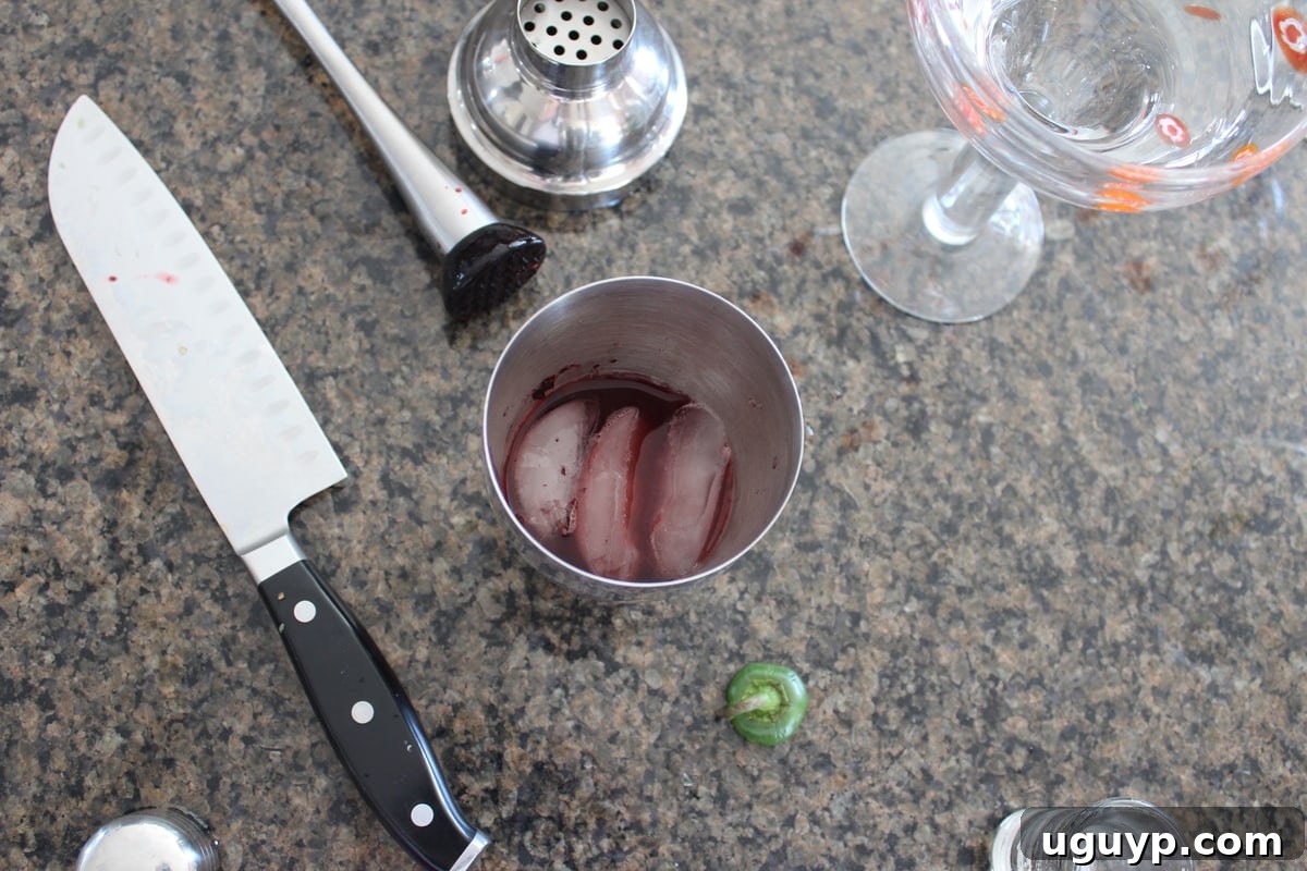 Mixing Fresh Blackberry Jalapeño Margarita ingredients