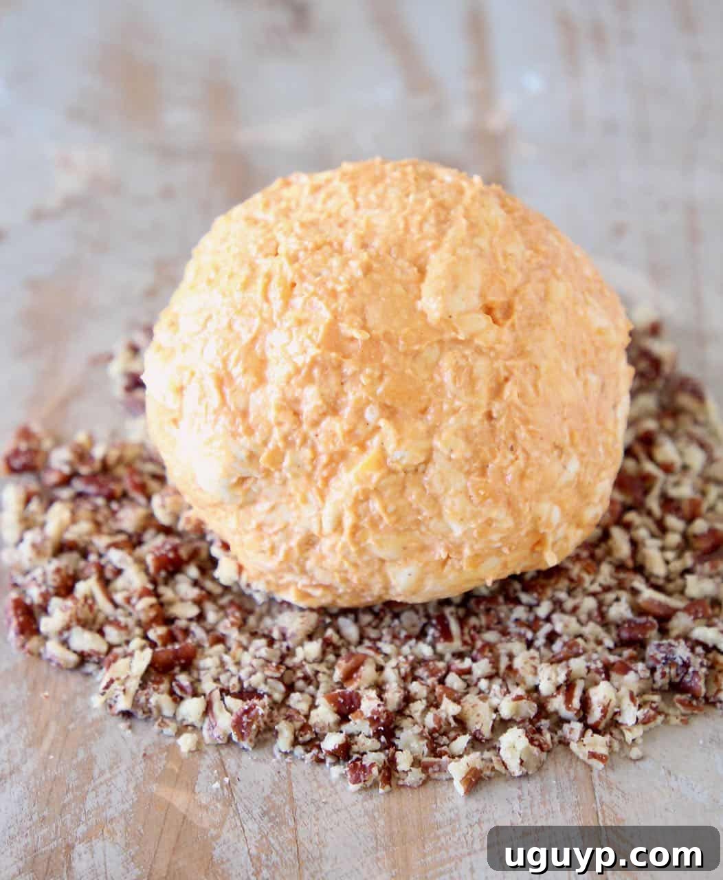 A visual guide showing the process of mixing ingredients and forming the Buffalo Cheddar Cream Cheese Ball.