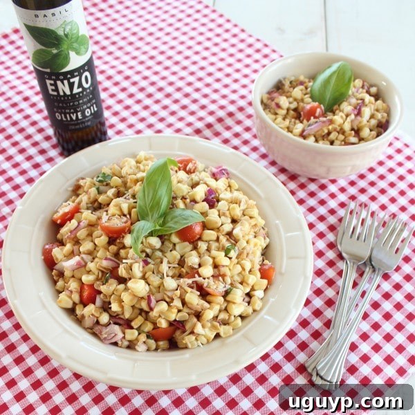 A close-up shot of the Italian Corn Salad with Parmesan cheese and basil, ready to be served.