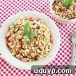 Italian Corn and Tomato Salad, garnished with fresh basil.