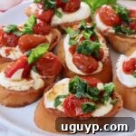 whipped ricotta and roasted tomato bruschetta on a plate