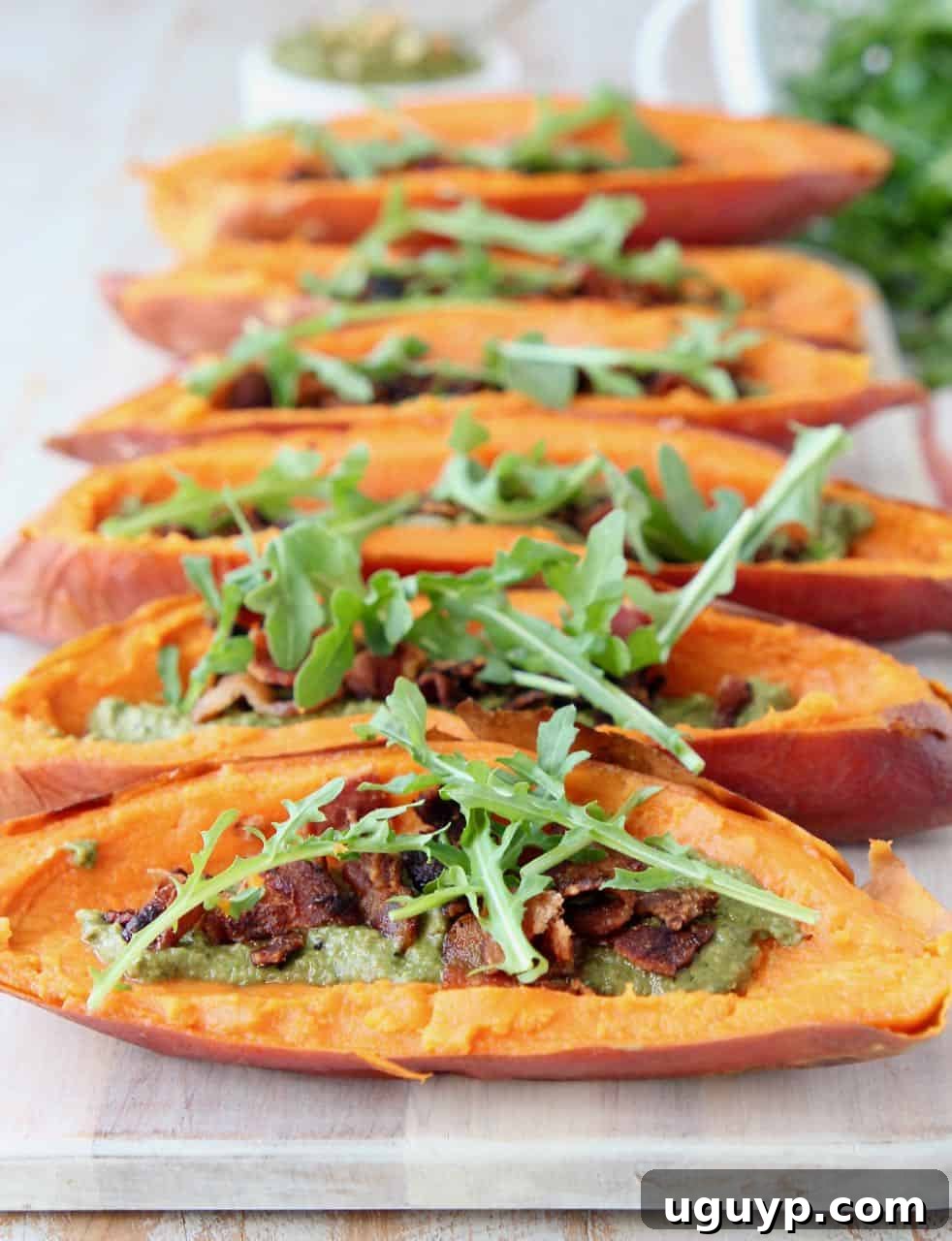 Loaded sweet potato skins on wood serving tray