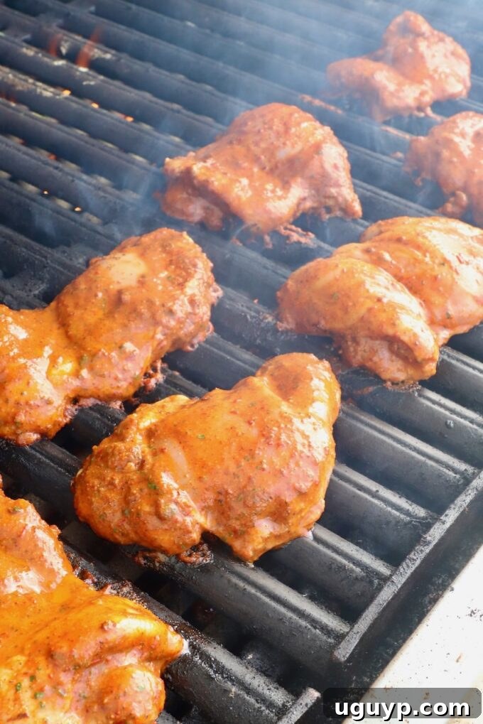 marinated chicken thighs on a grill