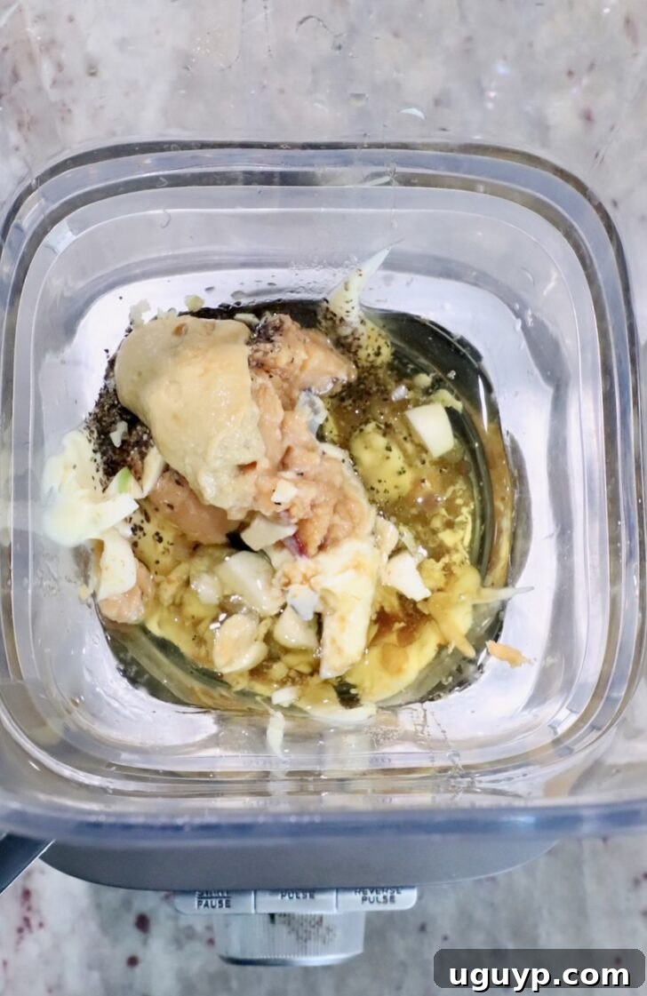 mayonnaise, miso paste, garlic, and oil in a blender