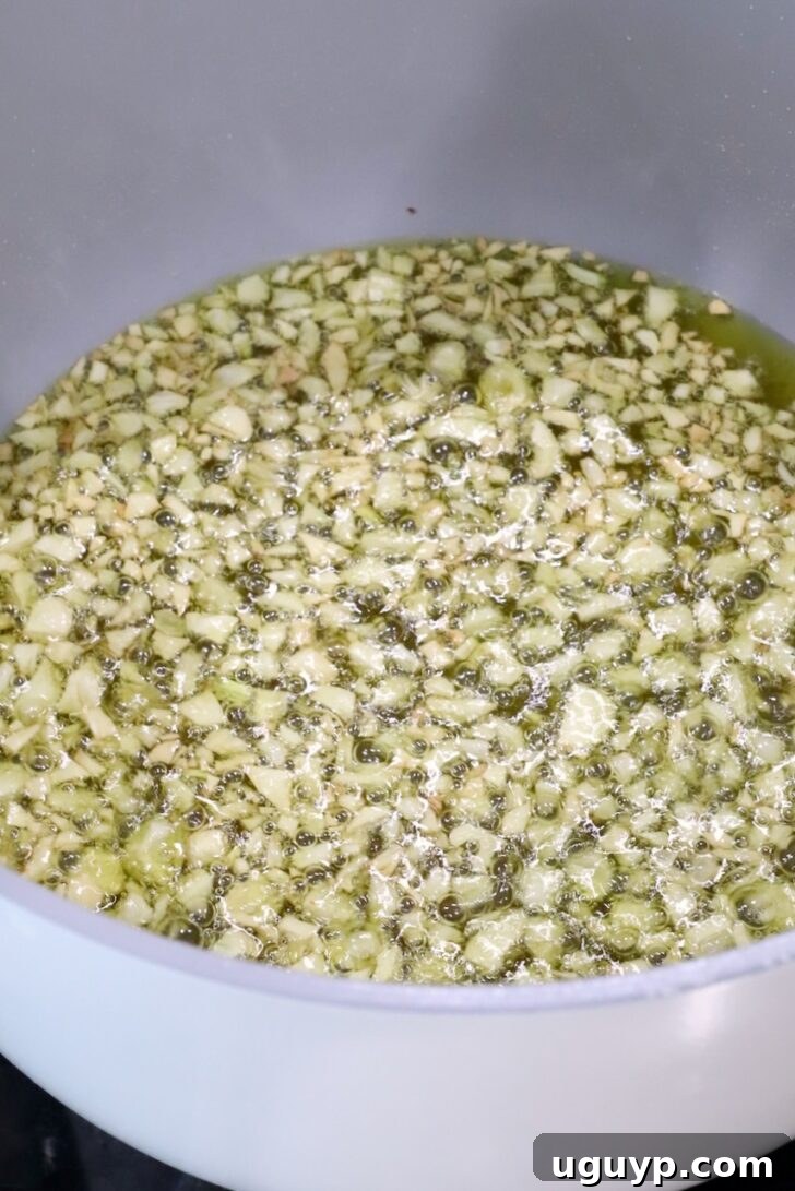 pot of oil and minced garlic on the stove