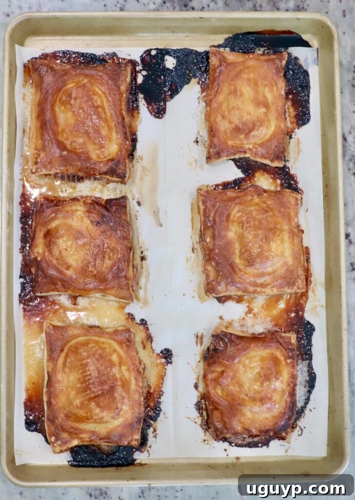 baked upside-down tarts on a parchment-lined baking sheet