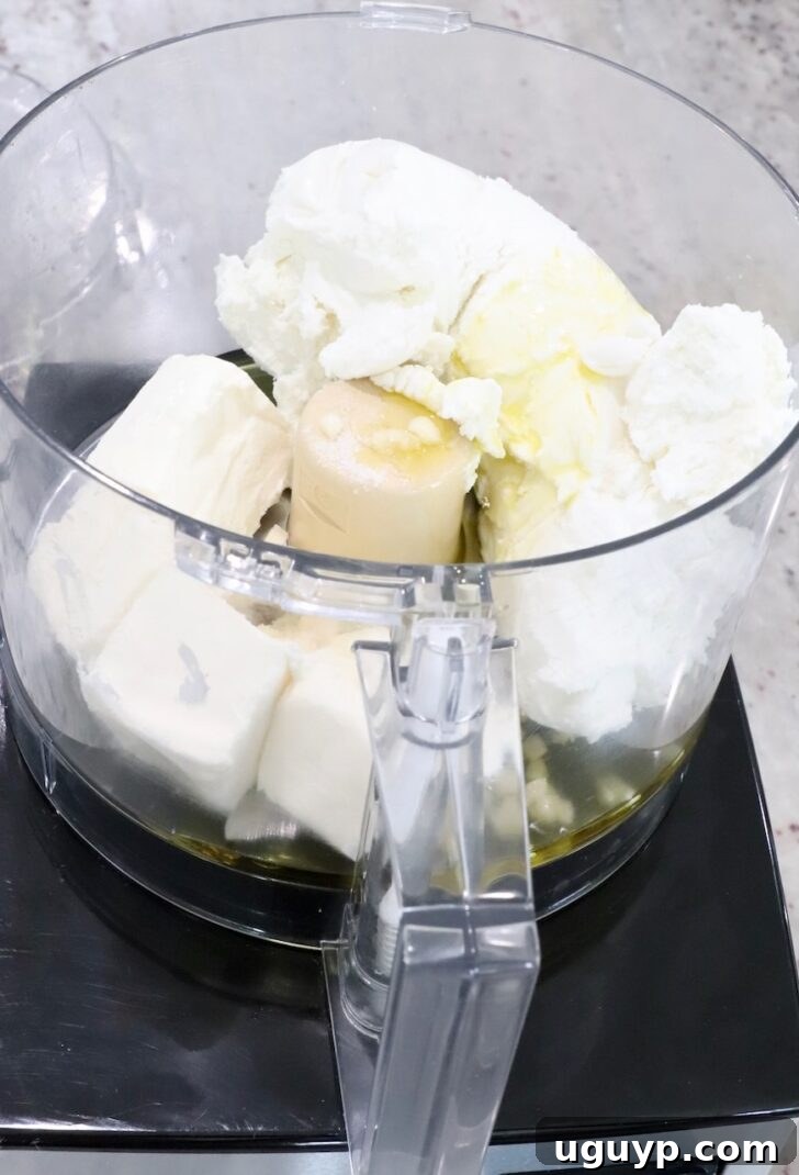 goat cheese, cream cheese, garlic and olive oil in a food processor