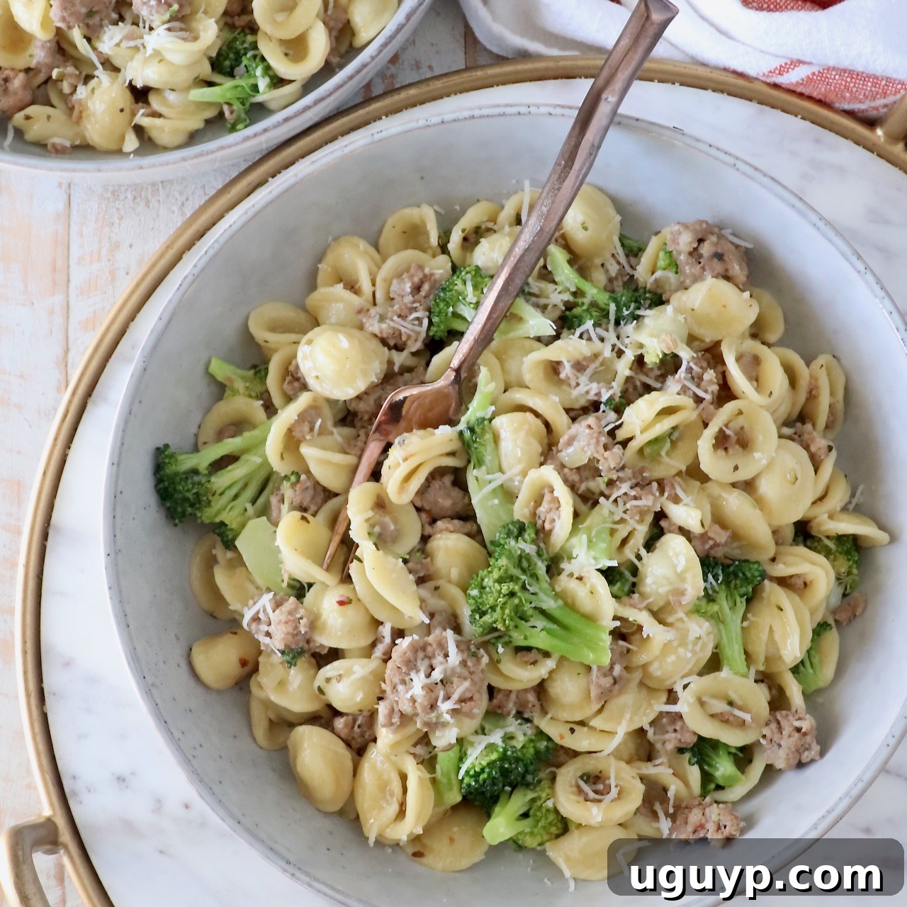 cooked orecchiette pasta with broccoli and Italian sausage