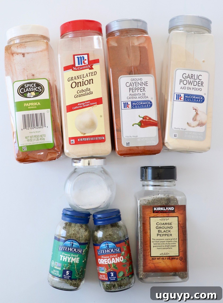 How to Use Blackened Seasoning: Tips for Bold, Smoky Flavor 5 dried herbs and spices in plastic containers on a white surface