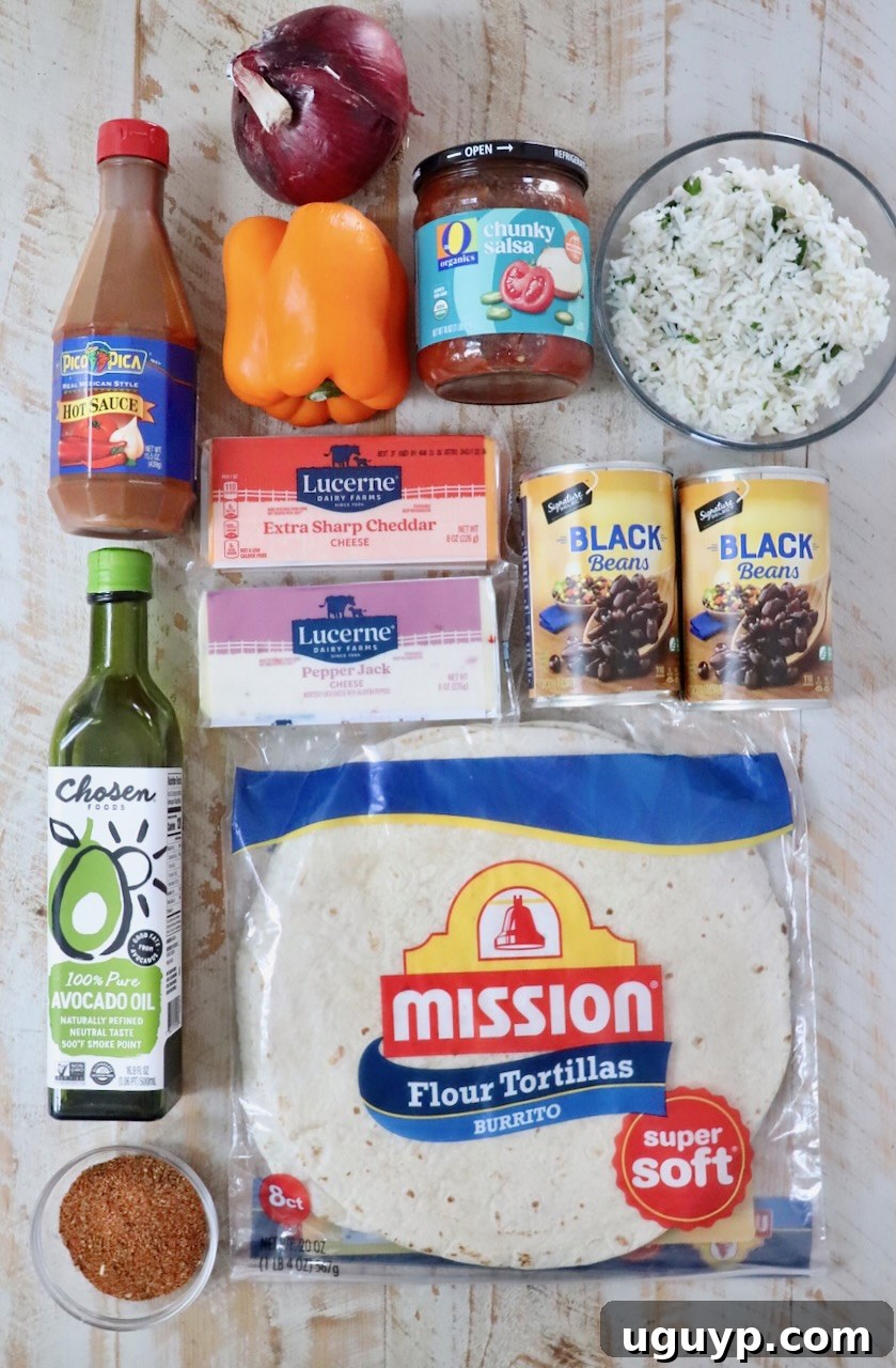 Cheesy Bean & Rice Burrito Recipe – Quick Weeknight Meal 5 ingredients for cheesy bean and rice burritos on a white wood board
